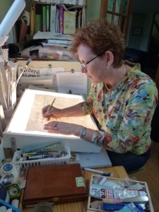 Anne working on Silverpoint calligraphy for Book 3 - the thoughts of Nelson Mandela about building peace
